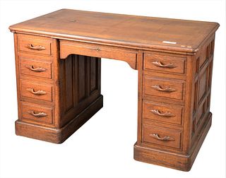 TG Sellew Victorian Quarter Sawn Oak Desk, having raised panels and carved pulls (top has two fine cracks), height 30 inches, top 28 1/2" x 48".