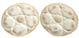 Six Theodore Haviland Limoges Baltimore Oyster Plates, having gilt rim and foliate details, diameter 8 1/4 inches.