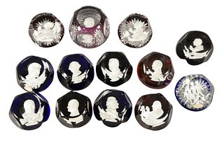 Thirteen Baccarat Glass Paperweights, having sulfide portrait bust interior, to include nine in a matching style. Provenance: Estate of James Wadhams.