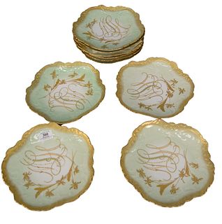 Set of Ten Elite Limoge Dinner Plates, having scallop gilt rims and foliate motif to the center, marked to the underside, height 9 1/4 inches.