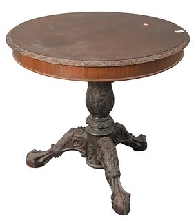 Round Occasional Table, having carved top over heavily carved pedestal base, ending in ball and claw feet, height 28 inches, diameter 32 inches.