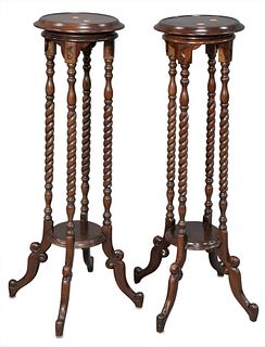 Pair of Mahogany Fern Stands, having round top over four barley twist legs, height 40 inches, diameter 11 1/2 inches.