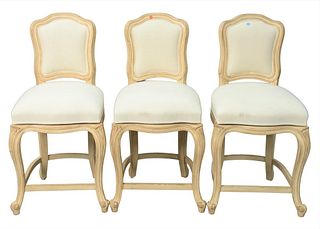 Set of Three Upholstered Barstools, each having swivel seats, height 38 inches, seat height 23 inches.