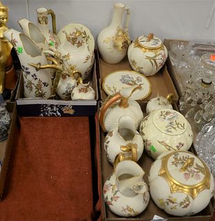 Sixteen Pieces of Royal Worcester Porcelain, having floral and gilt details on a cream ground, to include two pitchers having horn handles; two small 