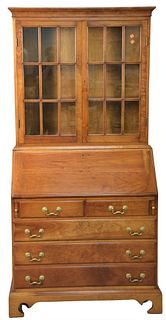 Stickley Cherry Two Part Secretary, having fitted interior with paper labels in drawer, height 75 inches, width 36 inches, depth 20 inches.