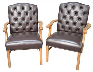 Pair of Oak Arm Chairs, having brown leather upholstered and tufted backs on square legs, height 38 inches, width 27 1/2 inches, depth 22 inches.