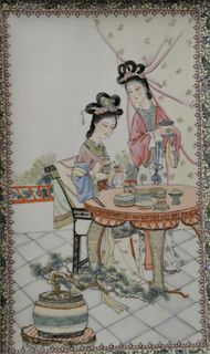 Pair of Chinese Painted Porcelain Tiles, one having two women and a pagoda, the other depicting two women in an interior scene, in matching frames, si