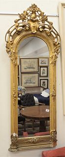 Small Victorian Pier Mirror, having giltwood frame and carved foliate details, height 64 inches, width 22 inches.