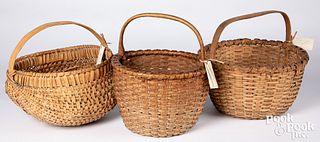 Three antique split oak baskets, largest - 13" h.,