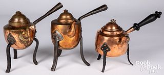 Three antique copper kettles