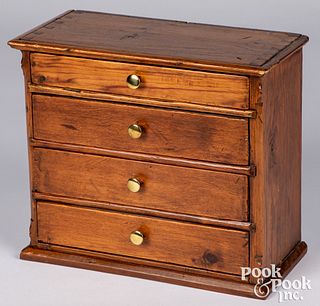 Miniature pine doll chest of drawers, 19th c.