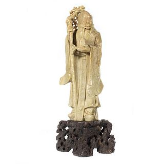 A Chinese Carved Stone Figure of a Sage