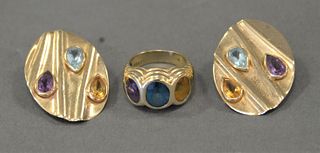 Three Piece 14 Karat Gold Group, pair of earrings and a ring with birth stones, 16.2 grams with stones.