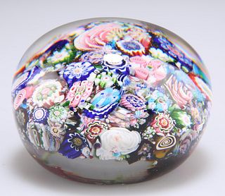 A SIGNED CLICHY CLOSE-PACKED MILLEFIORI PAPERWEIGHT, CIRCA 