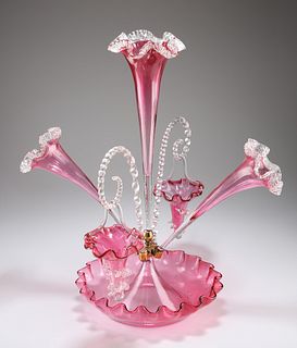A VICTORIAN CRANBERRY GLASS EPERGNE, the principal trumpet-