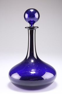 AN EARLY 19TH CENTURY BRISTOL BLUE GLASS DECANTER AND STOPP