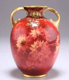 A DOULTON BURSLEM VASE, by Fred Hancock, decorated with flo