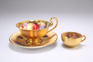 A ROYAL WORCESTER FRUIT PAINTED CUP AND SAUCER, the cup sig