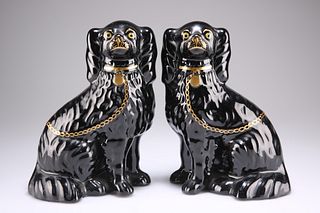 A PAIR OF VICTORIAN STAFFORDSHIRE MODELS OF SEATED SPANIELS