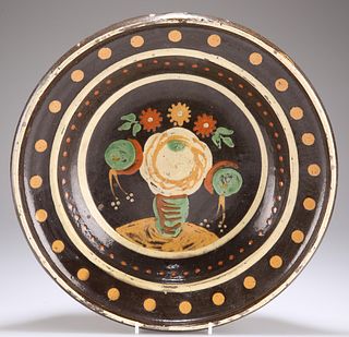 A LARGE SLIPWARE BOWL, circular tapering form, decorated wi