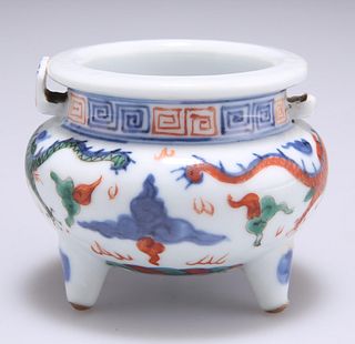A SMALL CHINESE DOUCAI PORCELAIN TRIPOD CENSER, typical for