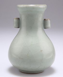 A CHINESE CELADON VASE, bottle shaped porcelain with twin h