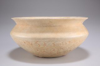 A CHINESE DING WARE BOWL, squat circular with ivory-white g