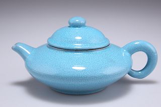 A CHINESE YIXING TURQUOISE CRACKLE GLAZED TEAPOT AND COVER,