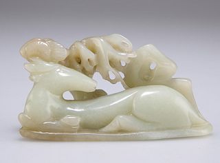 A CHINESE JADE "DEER" CARVING, of a recumbent stag beneath 