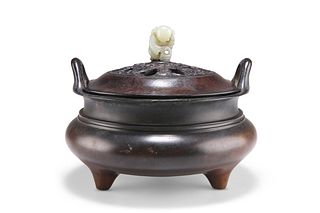 A CHINESE BRONZE TRIPOD CENSER, squat globular form with tw