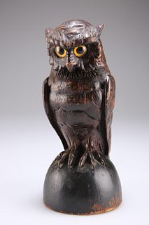 A BLACK FOREST CARVED AND STAINED SOFTWOOD MODEL OF AN OWL,