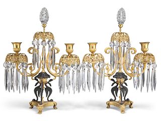 A PAIR OF EMPIRE REVIVAL GILT AND PATINATED BRONZE TWO-LIGH
