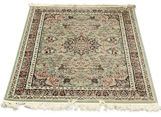 A TURKISH HAND-KNOTTED SHIRAZ RUG, the green field with bla