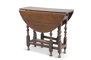 A SMALL 18TH CENTURY OAK GATELEG TABLE, the oval top raised