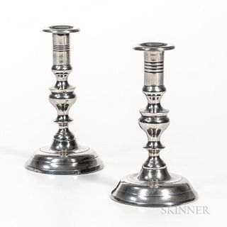 Pair of Pewter Push-up Candlesticks, America, mid-19th century, straight socket with wide drip-catcher on a knopped stem and round base