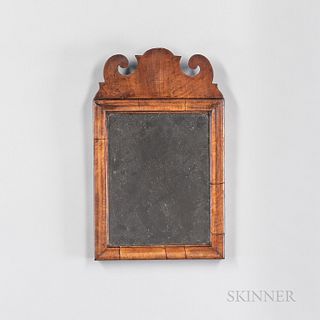 Small Queen Anne Walnut Veneer Mirror, America or England, late 18th century, the scrolled crest above a molded frame, (crest reglued),