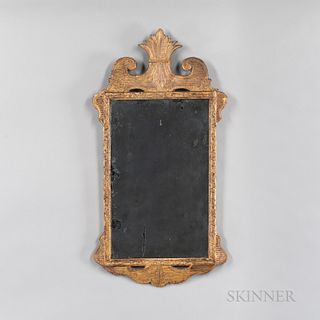Rococo Giltwood Mirror, England or Northern Europe, late 18th century, with shaped and scrolled crest centering a foliate device, the m
