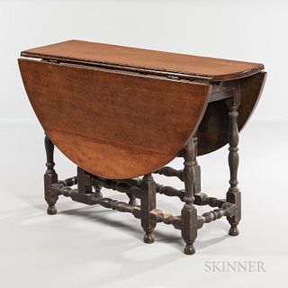 William and Mary Walnut and Maple Gate-leg Table with Falling Leaves, probably Massachusetts, early 18th century, the circular top on b