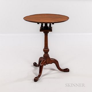 Mahogany Tilt-top Tea Table, Pennsylvania, late 18th century, the dished top above a birdcage support on a ring-turned post with suppre