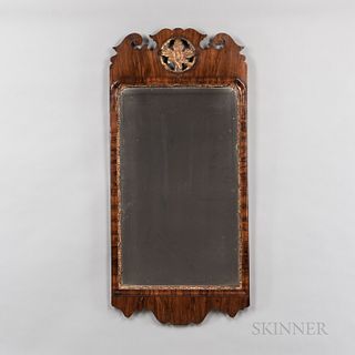 Large Exotic Wood Veneer Scroll-frame Mirror, probably England, late 18th century, the crest with pierced center and gilt-gesso leaf, a