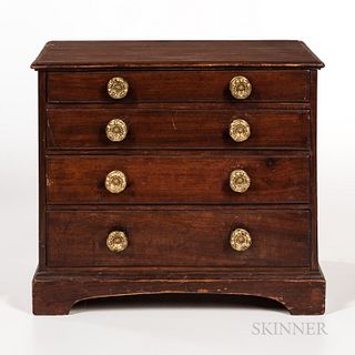 Miniature Mahogany Chest of Drawers, probably New England, c. 1790-1810, the molded top on a case of four scratchbeaded graduated drawe