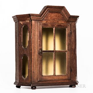 Glazed Oak Hanging Cupboard, 18th century, the molded cornice above a thumb molded hinged glazed door opening to two shelves, the side