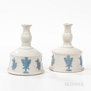Pair of Salt-glazed Candlesticks, Staffordshire, England, late 18th century, flaring sockets on ball-form bases with sprig molded urn a