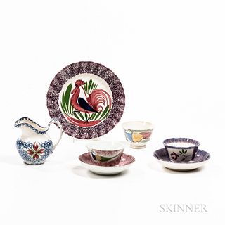 Five Pieces of Spatterware, England, early to mid-19th century, including a red spatter peafowl cup and saucer, a blue and purple flora