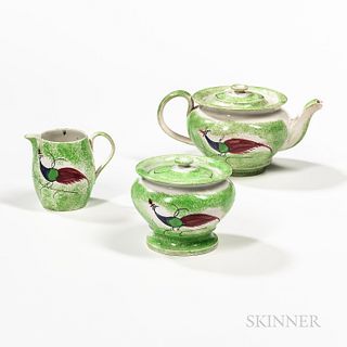 Three-piece Green Spatterware Peafowl Tea Set, England, early 19th century, comprising a teapot with cover, a sugar bowl with cover, an
