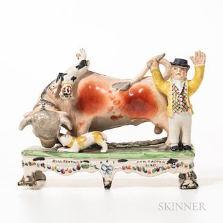 Polychrome Decorated Staffordshire Bull Figure, England, early 19th century, the bull fending off two dogs with a man in top hat at the