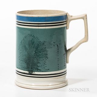 Dendritic Mocha and Slip-decorated Quart Mug, John Tams, Staffordshire, 19th century, broad mocha dendrites against a field of blue sli