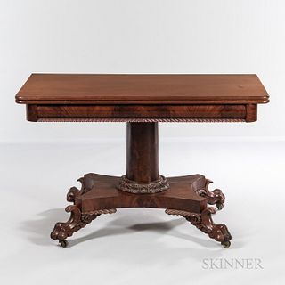 Classical Carved Mahogany Dining Table, probably Massachusetts, c. 1820-25, the rectangular folding top with rounded corners turns to b