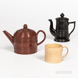 Three Stoneware/Redware Table Items, an engine-turned glazed redware teapot, a small yellow dry-bodied caneware mug with engine-turned
