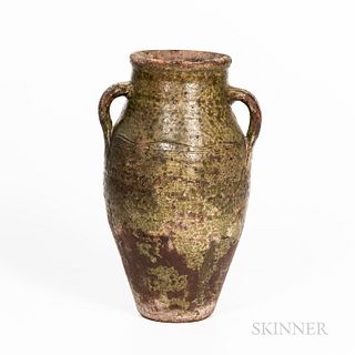 Green-glazed Redware Urn, 19th century, tall baluster-form body with two applied handles, with incised wavy line, (glaze losses and imp